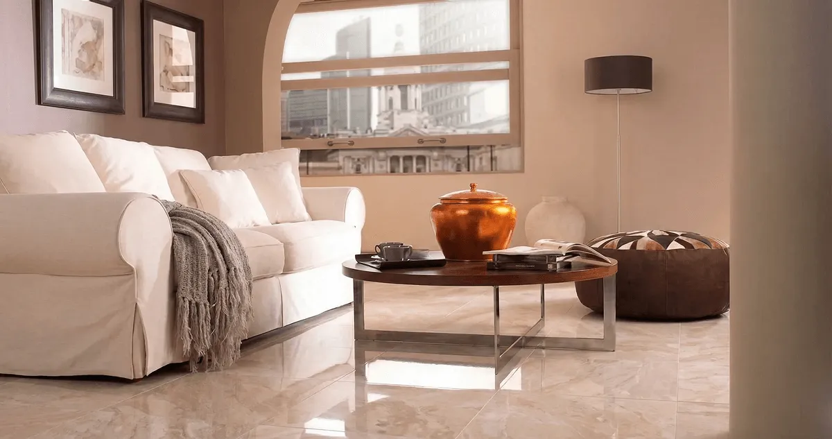 Modern living room with professionally installed marble flooring, a beige sofa, coffee table in Norfolk, VA