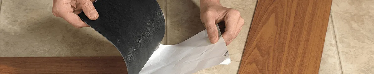 A professional installing vinyl flooring in Norfolk, VA